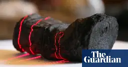 Researchers use AI to read word on ancient scroll burned by Vesuvius