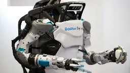 Forget making coffee — Boston Dynamics puts Atlas to work lifting heavy automotive struts in latest flex